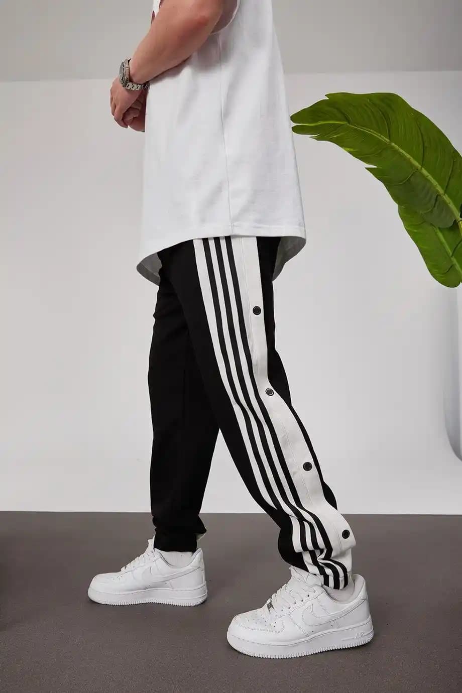 Yandan Düğmeli Eşofmanlar: Moda ve Fonksiyonelliğin Modern Buluşması