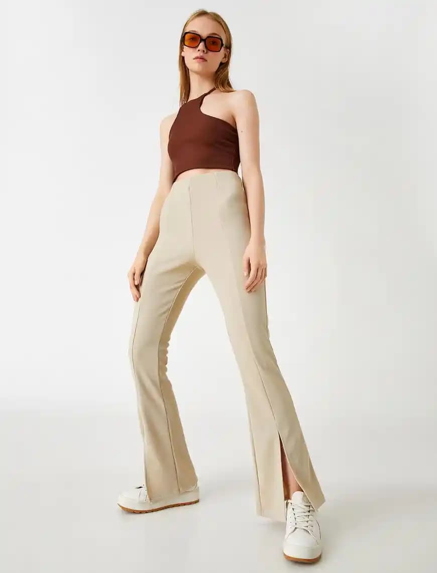 Yüksek Bel Yırtmaçlı Pantolonlar: Günümüz Moda Trendlerinde Şıklığın Vazgeçilmez Parçası