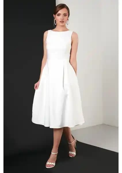 Lela Bisiklet Yaka Cepli Pileli Midi Elbise: Günlük Şıklık ve Rahatlık Sunan Modern Tasarım