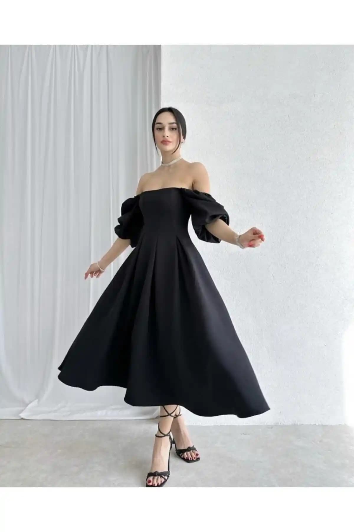 Afiş Butik Siyah Kare Yaka Pileli Midi Elbise Modern ve Şık Tasarım Özellikleri