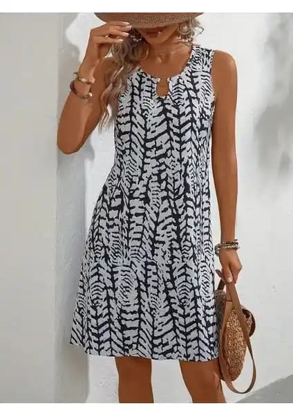 Kadın Yazlık Kolsuz Halka Detay Yaka Bürümcük Kumaş Elbise: Şıklık ve Konforun Buluşması